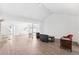 Spacious living room with vaulted ceilings and an open layout with neutral colors at 8645 Piper Ln, Seminole, FL 33777