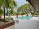 Inviting outdoor pool area with ample seating space for relaxation and entertaining at 8645 Piper Ln, Seminole, FL 33777