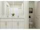 Modern bathroom featuring double sinks with white cabinets, shower, and toilet at 9405 Raised Tulip Ln, Land O Lakes, FL 34637