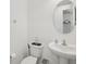 Bright bathroom with a pedestal sink and tile flooring at 9508 Pyrenees Pl, Seffner, FL 33584