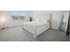 This bedroom offers abundant natural light, with plush carpeting, and a stylish accent mirror at 9508 Pyrenees Pl, Seffner, FL 33584