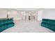 Expansive bonus room with plush carpet, light walls, and a view of the staircase and other rooms at 9508 Pyrenees Pl, Seffner, FL 33584