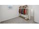 Bright closet space with a clothing rack, shelf, and a full-length mirror to check outfits at 9508 Pyrenees Pl, Seffner, FL 33584