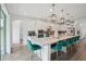 Bright kitchen with modern appliances, a large island with seating, and stylish pendant lighting at 9508 Pyrenees Pl, Seffner, FL 33584