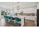 Spacious kitchen with white cabinetry, a large center island, and sleek appliances at 9508 Pyrenees Pl, Seffner, FL 33584