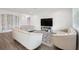 Elegant living area with tufted sofas, accent pillows, and stylish decor at 9508 Pyrenees Pl, Seffner, FL 33584