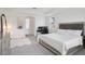 Bright main bedroom with tray ceiling, ensuite bathroom access, and carpet floors at 9508 Pyrenees Pl, Seffner, FL 33584