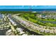 Stunning aerial view of the waterfront community, highlighting water access and proximity to the beach at 978 Signet Dr, Apollo Beach, FL 33572