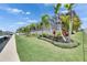 Waterfront home featuring a screened patio, luscious landscaping and ample backyard space at 978 Signet Dr, Apollo Beach, FL 33572