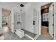 This stylish bathroom features a glass shower, tile flooring, and neutral finishes at 978 Signet Dr, Apollo Beach, FL 33572