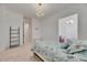 Bright, airy bedroom with a decorative princess theme, a bed and crown-style lighting at 978 Signet Dr, Apollo Beach, FL 33572