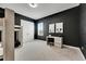 Chic ' bedroom with black accent wall, bunk beds, a desk and decorative Mickey Mouse prints at 978 Signet Dr, Apollo Beach, FL 33572