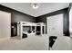 bedroom featuring a bunk bed, black accent wall, and a white closet at 978 Signet Dr, Apollo Beach, FL 33572