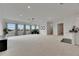 Large bonus room featuring neutral carpet and an entertainment space with natural light at 978 Signet Dr, Apollo Beach, FL 33572