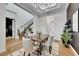 Open-concept dining area featuring stylish lighting, elegant decor, and seamless flow at 978 Signet Dr, Apollo Beach, FL 33572