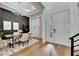 Elegant dining room with modern light fixture, stylish decor, and hardwood flooring at 978 Signet Dr, Apollo Beach, FL 33572