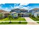 Traditional two-story home with a neutral exterior and meticulous landscaping at 978 Signet Dr, Apollo Beach, FL 33572