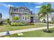Beautiful two-story home featuring a well-manicured lawn, mature landscaping, and inviting curb appeal at 978 Signet Dr, Apollo Beach, FL 33572