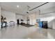 Spacious garage equipped with gym equipment, storage racks, and ample room for vehicles at 978 Signet Dr, Apollo Beach, FL 33572