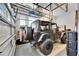 Organized garage featuring overhead storage and a black jeep, providing plenty of space at 978 Signet Dr, Apollo Beach, FL 33572