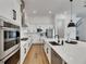 Modern kitchen design features sleek white cabinetry, stainless steel appliances, and expansive countertops at 978 Signet Dr, Apollo Beach, FL 33572