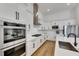 Modern kitchen offers clean lines, stainless steel appliances, white cabinetry, and sleek design at 978 Signet Dr, Apollo Beach, FL 33572