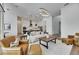 Bright living room features modern lighting, hardwood floors, and an open floor plan flowing into the kitchen at 978 Signet Dr, Apollo Beach, FL 33572