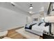 A bright main bedroom features neutral colors, light hardwood flooring, and recessed lighting at 978 Signet Dr, Apollo Beach, FL 33572