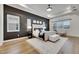 A spacious main bedroom features light hardwood flooring and recessed lighting at 978 Signet Dr, Apollo Beach, FL 33572