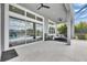 Large covered patio with sliding glass doors, providing seamless indoor-outdoor living and great views at 978 Signet Dr, Apollo Beach, FL 33572