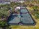 Enjoy the community tennis courts surrounded by beautiful mature trees and landscaping at 978 Signet Dr, Apollo Beach, FL 33572
