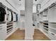 A well-organized walk-in closet features shelving and drawers at 978 Signet Dr, Apollo Beach, FL 33572