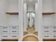 The walk-in closet features a center mirror, shelving, and drawers at 978 Signet Dr, Apollo Beach, FL 33572