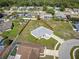 Wide angle aerial shot of a charming single Gathering home on a large lot with wooden privacy fence at 10115 Briar Cir, Hudson, FL 34667