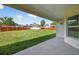 Spacious, fully fenced backyard with lush green grass at 10115 Briar Cir, Hudson, FL 34667