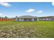 Large backyard with lush green grass, ideal for outdoor activities and relaxation at 10115 Briar Cir, Hudson, FL 34667