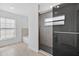 Modern bathroom featuring walk-in shower with sliding glass door at 10115 Briar Cir, Hudson, FL 34667