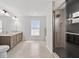 Spacious primary bathroom with double vanity, a glass shower, and a window at 10115 Briar Cir, Hudson, FL 34667