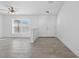 Versatile living space with tile flooring and natural light from a large window at 10115 Briar Cir, Hudson, FL 34667