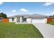 Charming single-story home with a well-manicured lawn and inviting front entrance at 10115 Briar Cir, Hudson, FL 34667
