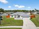 Charming home with well-manicured lawn, a large driveway and an attached two-car garage at 10115 Briar Cir, Hudson, FL 34667