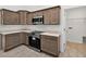 Charming kitchen featuring wood cabinets, stainless steel microwave and white countertops at 10115 Briar Cir, Hudson, FL 34667