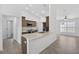 Modern kitchen featuring stone countertops, stainless steel appliances, and ample cabinet space at 10115 Briar Cir, Hudson, FL 34667
