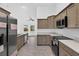 Stainless steel fridge with light wood cabinets and stainless steel appliances at 10115 Briar Cir, Hudson, FL 34667