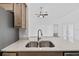 Close up of the kitchen sink and countertops, with stainless steel appliances nearby at 10115 Briar Cir, Hudson, FL 34667