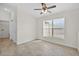 View of the living room with tiled floors and access to storage at 10115 Briar Cir, Hudson, FL 34667