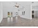 Bright living room with high ceilings, tile floors and views of the backyard at 10115 Briar Cir, Hudson, FL 34667