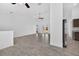 Living room with tile floors, ceiling fan and white walls at 10115 Briar Cir, Hudson, FL 34667