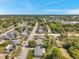 Aerial view of a residential neighborhood showcasing cozy homes, tree-covered lots, and a close-knit community feel at 10125 Cherry Creek Ln, Port Richey, FL 34668