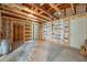 Unfinished basement with exposed ceiling joists and studded walls, ready for customization at 10125 Cherry Creek Ln, Port Richey, FL 34668